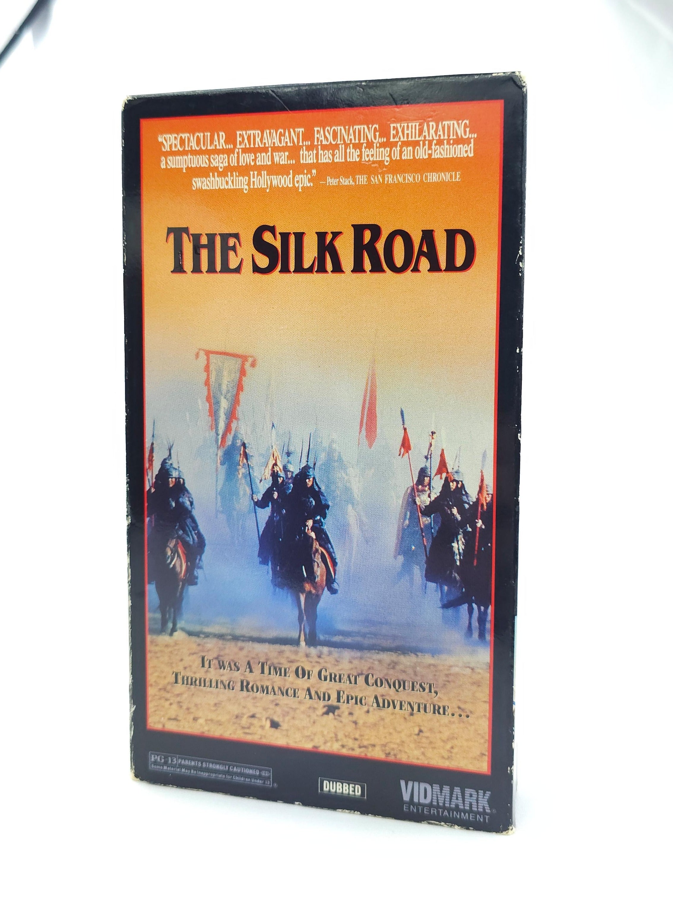 VHS tape cover of 'The Silk Road' with soldiers on horses and flags.