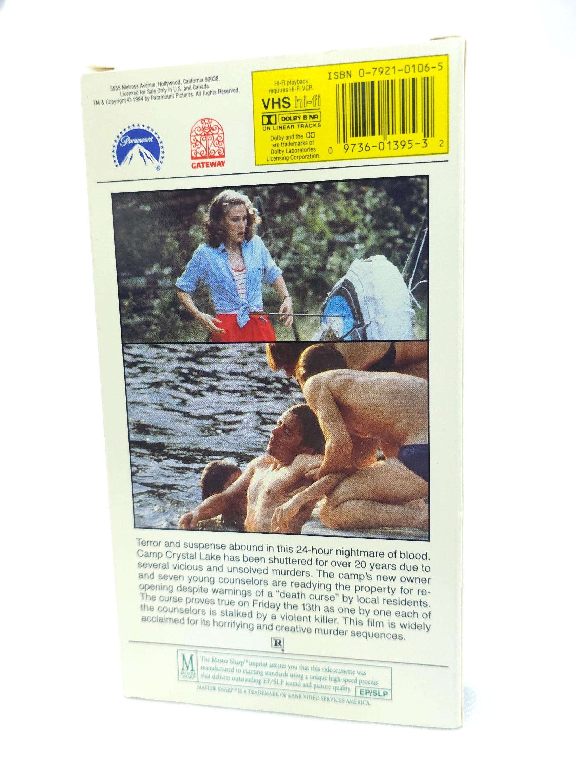 VHS tape cover with a scene of people by a river and a visible label.